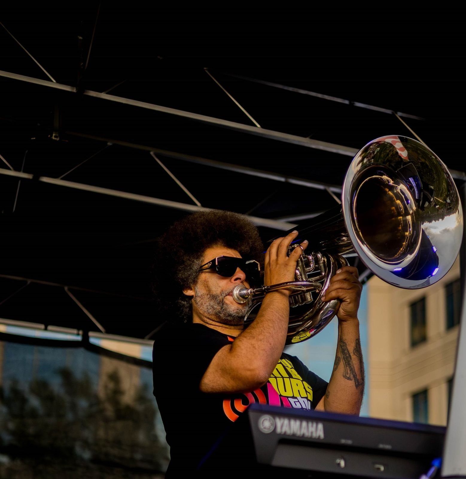 Little Moses Jones playing tuba on stage